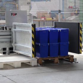 Stationary pallet changer side mover with plastic buckets